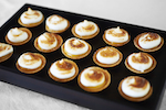 Miniature lemon meringue tarts.