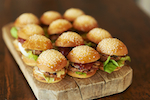 Miniature waygu burgers with gruyere cheese & pancetta crisp.